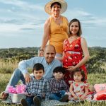 Generational family enjoying a sunny day picnic in La Dorada, Caldas.
